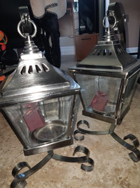 set of brushed nickel lantern style candle holders