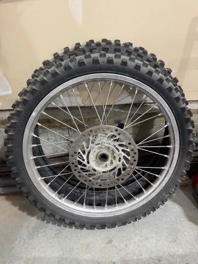 Selling a complete 21” front wheel with a mounted Michelin Starcross 5 tire, plus an extra unmounted...