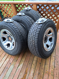 Set of 4 Winter 265/70R17 Studded tires and Chrome  Mags Lug Cap