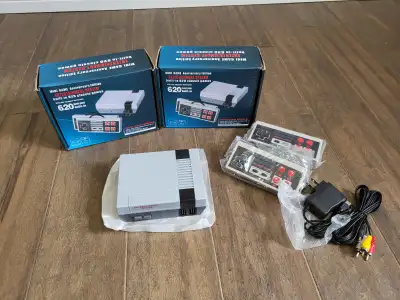 Brand new mini classic video game system for sale. Preloaded with 620 games, 2 controllers, power co...