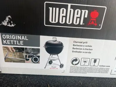 Brand new in box never opened. 22” kettle original Weber charcoal grill $150. Usually over $200 new....