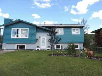 Please contact Paul Medvid at 403-332-2904 4 beds, 1.5 bath, 2150 sq ft with a wood stove and oil fu...