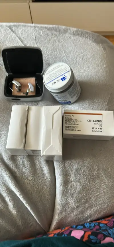 Resound hearing aids 2 different colours so you don’t mixed sides Used 1 week Jar dehumidifier 4 box...
