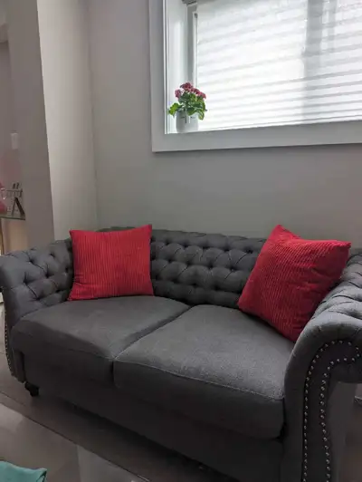 grey 2-seater sofa Matching armchair Both in very good condition Stylish, comfortable, and clean Fro...