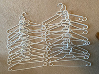 white adult clothes hangers