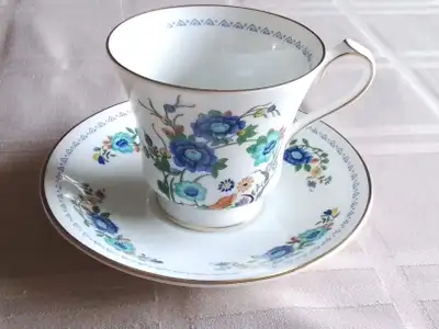 MARLINA, AYNLEY - FINE BONE CHINA CUP AND SAUCER. BLUE ORIENTAL FLOWERS AND RIMS. MADE IN ENGLAND. I...