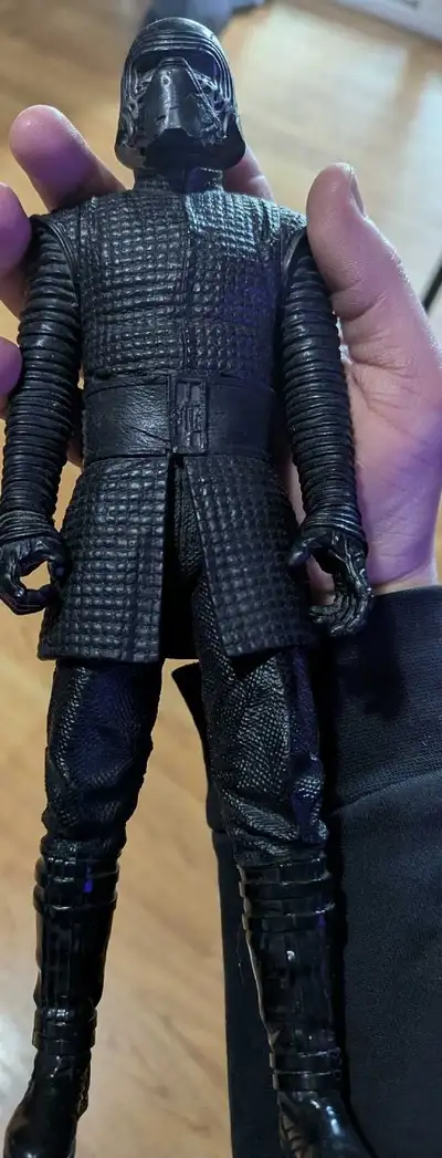 This is a Kylo Ren action figure, complete with detailed costume and mask, making it a great additio...