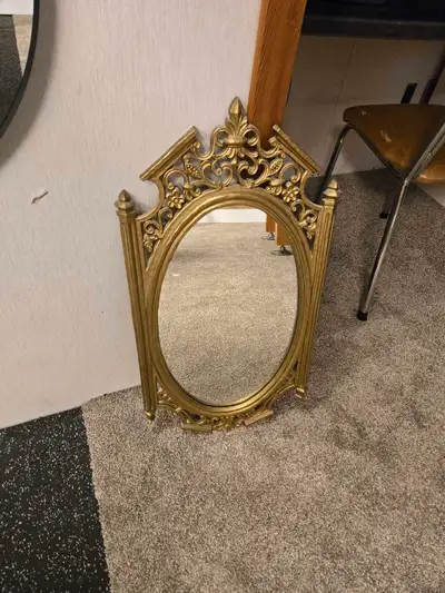 One 32" × 18" gold colored Baroque style mirror - $25