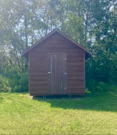 Cedar siding, asphalt shingles. Solidly built. Currently contains firewood - about half full. Firewo...