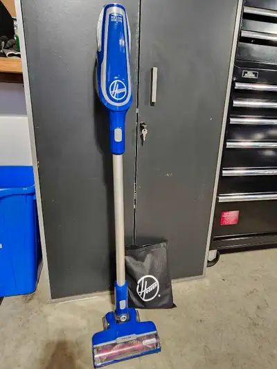 Hoover rechargeable vacuum comes with charger wall hanger and accessories. Great for small areas has...