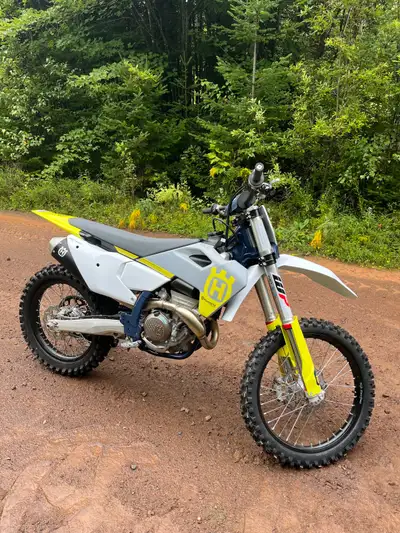 Bike has 5 hrs on it works great and have extra chain and sprockets and skid plate, extra air filter...