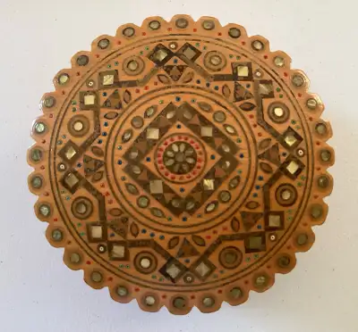 Although there are no markings that I could see, I'm told that this gorgeous round lidded wooden box...