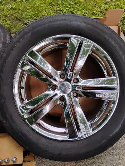 Set of 4 chrome rims with Pirelli Cinturato all season tires and a set of closed wheelnuts w/locking...