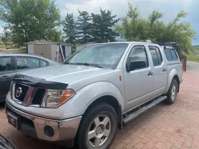 2006 Nissan Frontier 220,000 kms $11,500. Matching topper Grey 2 wheel drive Wind deflector Window r...
