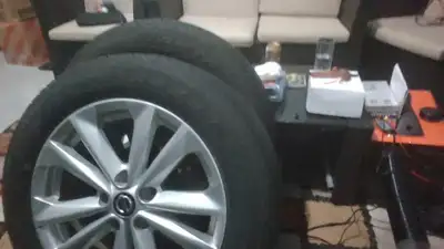 17x7 inch rims with 215/60R17 tires Factory trim Nissan Aluminum Rims on tires for only 1200. Price...