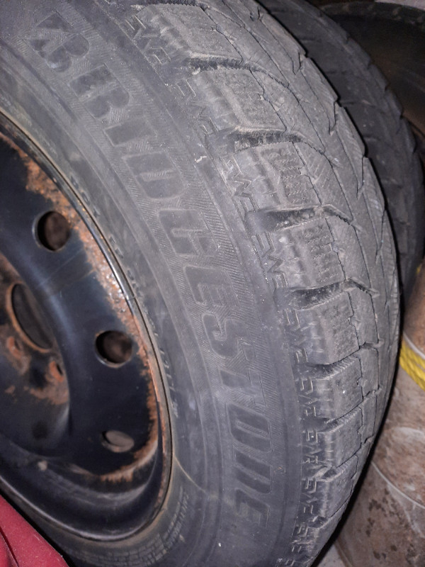 Four 195/65R15 Blizzak snow tires on steel rims, used in Tires & Rims in Mississauga / Peel Region