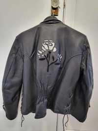 Motorcycle grade black leather jacket. Silver roses details.