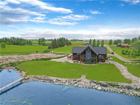 Waterfront Property. Luxurious hand crafted Log home