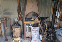 Blacksmithing tools including anvil and forge