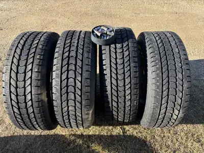 I'm selling a set of used 18-inch studded winter tires mounted on rims, perfect for providing extra...