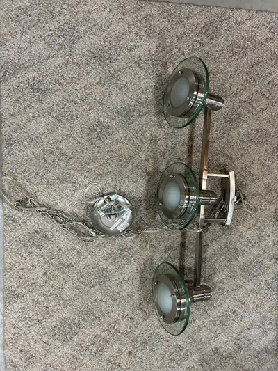 Chain is 58 inches long. Fixture is 32 inches long and each glass disc is 8 inches in diameter.
