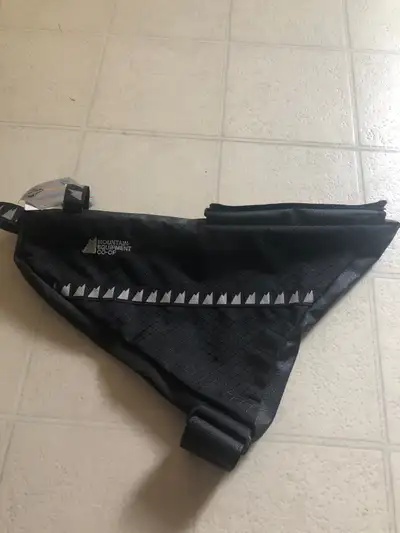 New with tags Mountain Equipment Co-Op large frame bag with reflective material. Velcro and zippers...
