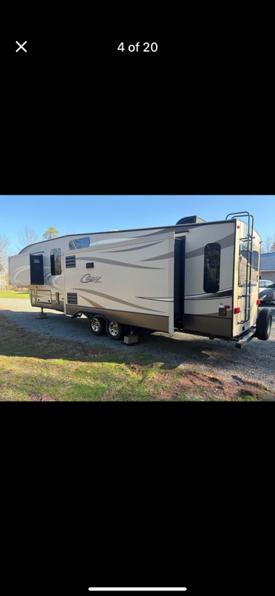333 MKS Cougar Fifth Wheel. Has 3 slide outs,power awning, led lighting under awning,power levelling...