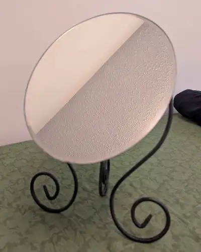 Ikea table or desk mirror, oval shape. It's 15 inches height, the mirror glass itself is 11x8 inches...