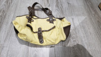 Yellow purse lined with brown