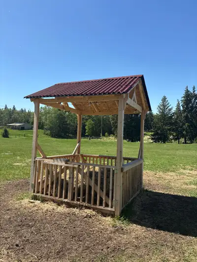 We built this feeder last fall. Covered with solar lights. Holds a round bale or 14 square bales. Re...