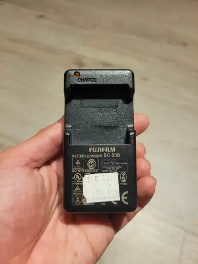 This is a used Fujifilm BC-50B battery charger, perfect for charging your Fujifilm camera batteries....