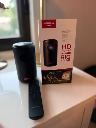 Brand New & Sealed – Nebula by Anker Capsule Max Portable Projector Perfect for movie nights, campin...