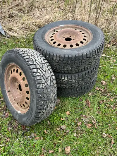 Set of 4 pirelli ice zero studded winter tires on rims. Rusty rims but balanced and ready to go. Use...