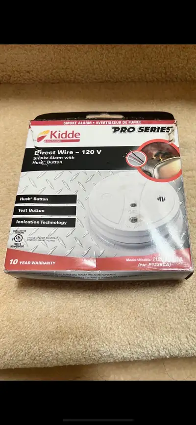 Kidde Pro Series direct wire smoke alarm. It has a hush button, View more