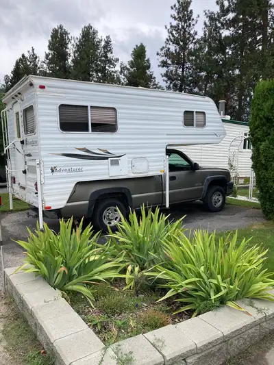 A 2003 Chevy Silverado 2500 in very good running condition with air, tilt, cruise and good tires (19...