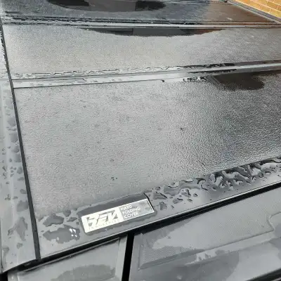 Tonneau cover from 2022 GMC SIERRA 1500 with 5' - 8" truck bed. It's a Tri-fold, hard cover, in exce...