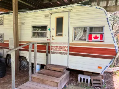 22 ft long x 8 ft wide , has wheels and rolls on , includes fridge, AC, stove, has conections for wa...