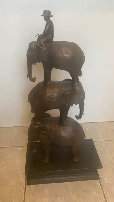 Bronze Sculpture of a Man Riding Three Elephants.24” tall., View more