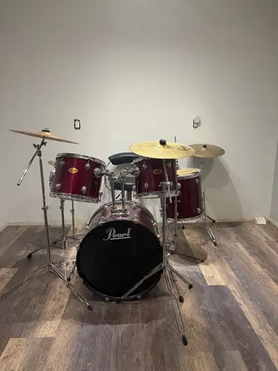This is a used Pearl drum set, perfect for anyone looking to start playing the drums or upgrade thei...