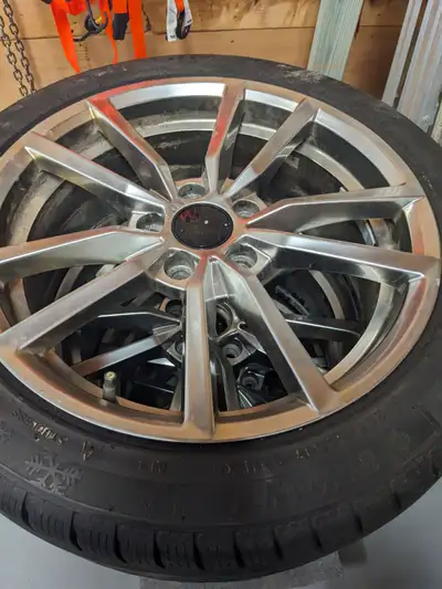 New winter tires on aluminum rims - 225/45 r17. These rims came off a 2016 Audi A3. The tires were p...