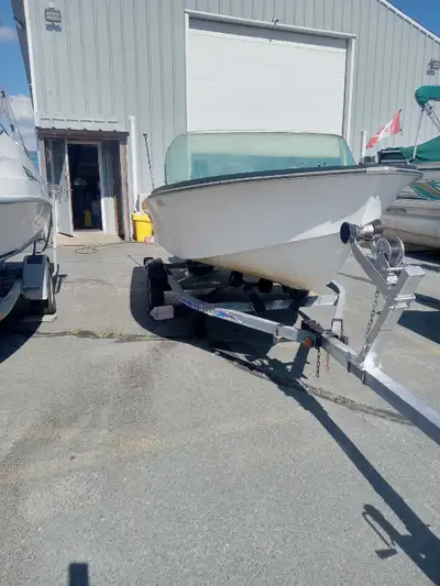 Forsale a 16 foot fiberglass boat with galvanized trailer No motor Has steering system and seats ste...