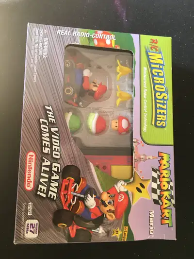 Official Mario Kart microsizer race car. Never used, near mint condition. Collectors item. Batteries...