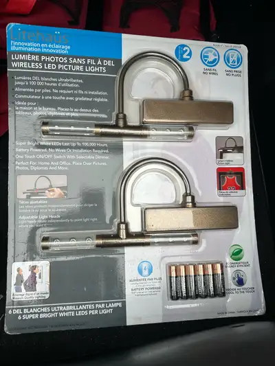 I'm selling a new package of Litehaus wireless LED picture lights. This set comes with two lights th...