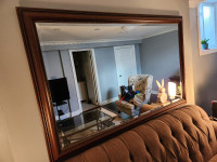 Large Wood-Framed Beveled Mirror with Brass Button Detailing