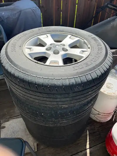 4 tires with rims, 2 tires still good 235/70R16. From ford escape