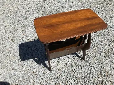 Mid Century Modern end table and magazine rack. Perfect for end of a couch or a stand alone. Size is...