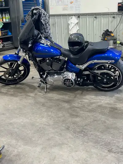 I'm selling a 2014 Harley-Davidson Breakout, a real head-turner with its striking blue finish and cu...