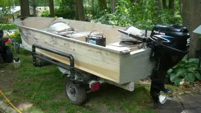 Aluminum boat, 14 feet, 2 seats, good trailer, electric start 15 hp four stroke outboard, fuel tank...