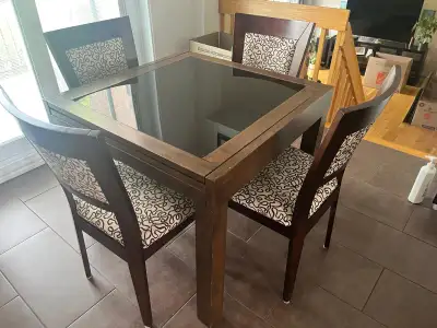 2 tables with glass top and 4 chairs included