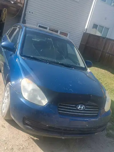 2006 Hyundai Accent Colour: Blue 240,000 km mostly highway driven CONS Driver side axle needs replac...
